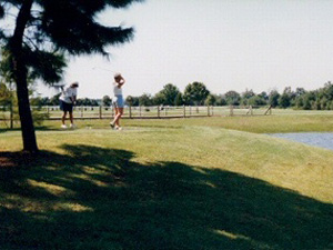 Golfers on golf course green